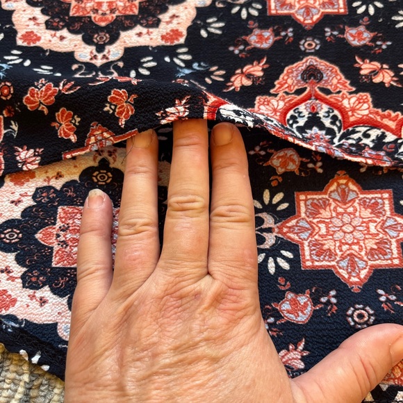 Lightweight polyester sleeveless with long tail in back and zipper front. - Picture 6 of 9